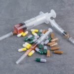 Assorted pharmaceutical capsules and syringes with serums. High quality photo